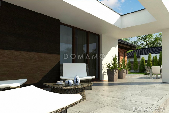 Проект одноэтажного просторного дома из кирпича с отрытой террасой и гаражом для двух автомобилей