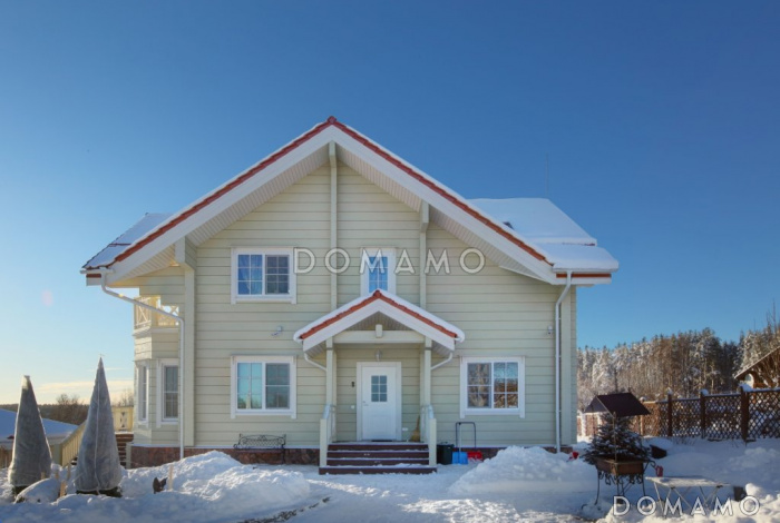 Проект дома из клееного бруса с гостиной, совмещенной с кухней-столовой