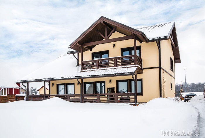 Проект мансардного дома из газобетона с 4 спальнями, кабинетом, сауной и крытой террасой