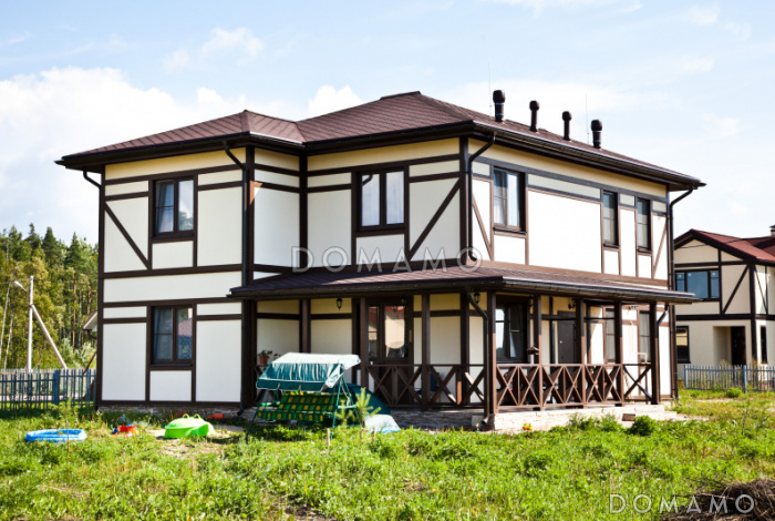 Проект двухэтажного дома из кирпича в стиле фахверк