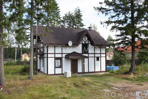 Проект дома из пеноблоков в стиле фахверк с сауной на мансардном этаже