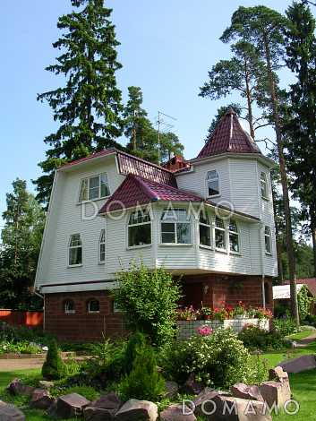 Проект коттеджа с зимним садом и гаражом