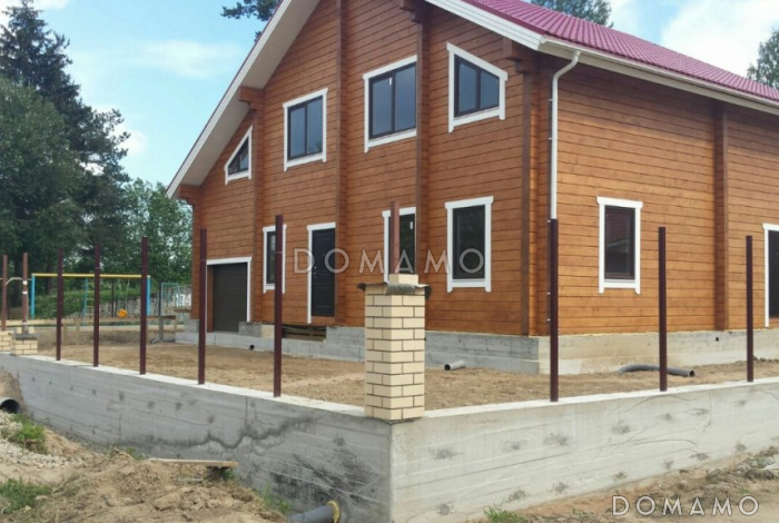 Проект деревянного дома из клееного бруса с встроенным гаражом