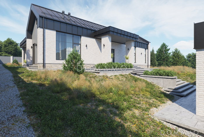 Проект кирпичного дома с масштабным остеклением, двумя жилыми зонами, соединенными гостиной-столовой