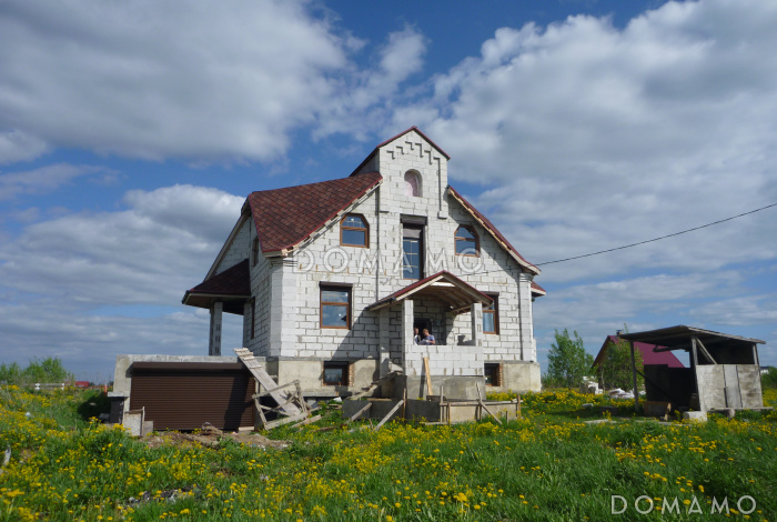 Проект коттеджа с подвалом и зимним садом из кирпича
