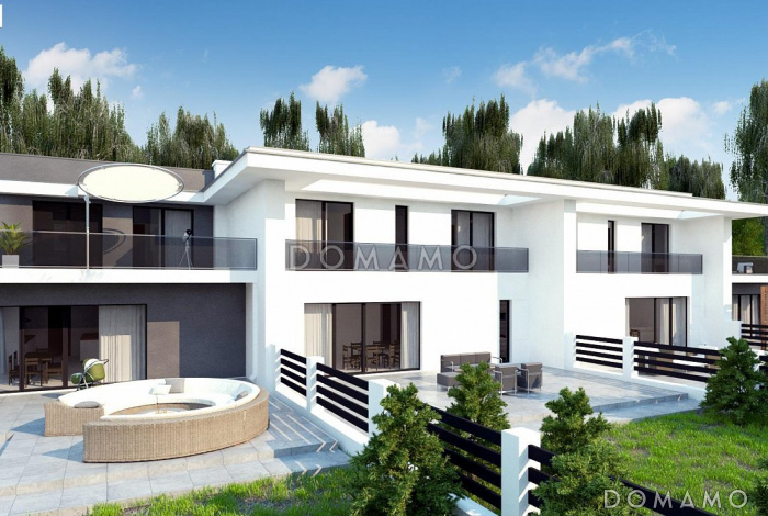 Проект современного комфортного двухэтажного дома из газобетона для двух семей с общим гаражом